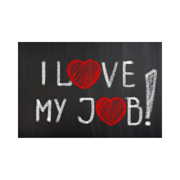 A sign in chalk on a blackboard saying I Love My Job!