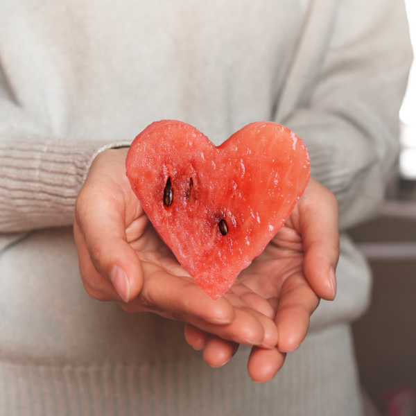 Melonbox Training & Consultancy - a person holding a heart shape in their hands.