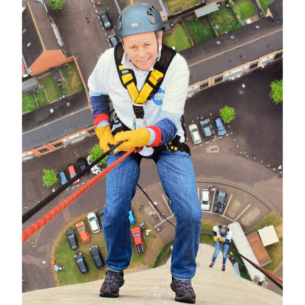 Melonbox Training & Consultancy - a picture of the business owner, Linda, abseiling down a 400ft tower!